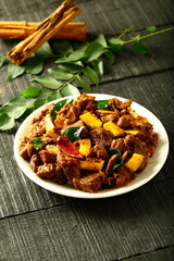 Plate of delicious meat fry,  ulath erachi, irachi, from Kerala cuisine. fried beef, mutton, 