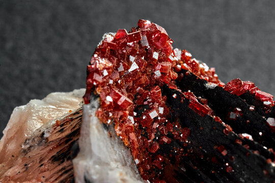 Closeup shot of vanadinite over a grey background