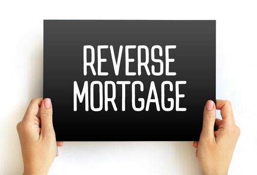 Reverse Mortgage - secured by a residential property, that enables the borrower to access the unencumbered value of the property, text concept on card