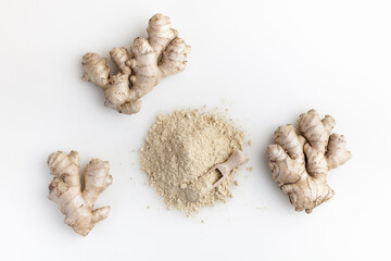 Set of fresh ginger root and powder islolated on white background. Top view.