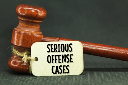 wooden hammers and wooden tags with the words serious offense cases