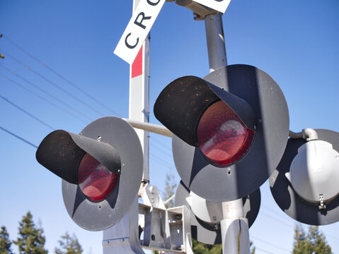 Closeup shot of railroad crossing lights in Turlock, California, USA against a clear sky
