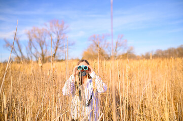 Stuck in the weeds - searching for wildlife with binoculars in a marsh