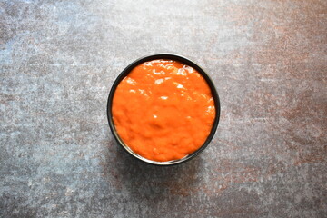 Fresh spicy red chilli sauce in a bowl