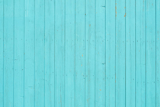 Old vintage beach wood background or wallpaper - faded turquoise wood planks