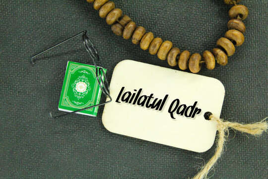 tasbih, spectacles and the form of the Quran with the words laylatul qadr or lailatul qadar