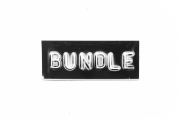 Black color banner that have embossed letter with word bundle on white paper background