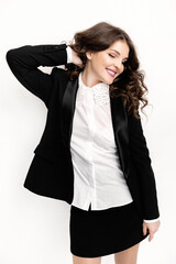 Joyful young business woman is happy about her work achievement, smiling with eyes closed. Beautiful female freelancer or student got a job promotion or passing important exams, success concept