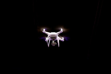 Fototapeta premium Drone is flying against isolated black background
