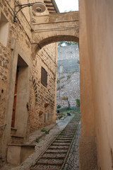 Vertical shot of the narrow street in Assisi. Italy.