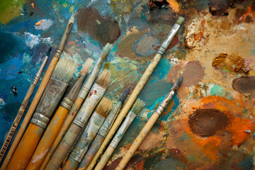 Tubes of oil paint and artist paint brushes