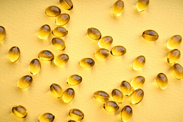 Vitamins. Fish Fat Oil Capsules. Fish oil capsules isolated on white background. Close up of capsules Omega 3 on white background. Health care concept. Nutritional supplements.