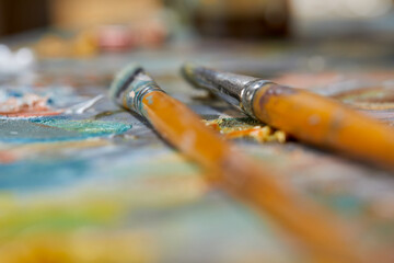 Tubes of oil paint and artist paint brushes