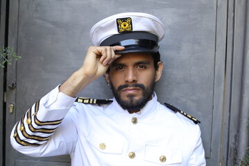 Attractive ship captain with elegant uniform 