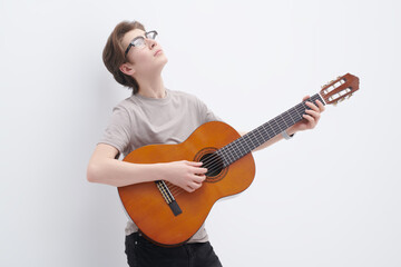 Fototapeta premium boy playing the guitar