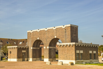 Den Helder, Netherlands, April 2022. The gatehouse and the Huisduinen lighthouse in the background.