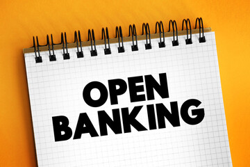 Open Banking - financial technology that enable third-party developers to build applications and services around the financial institution, text concept on notepad