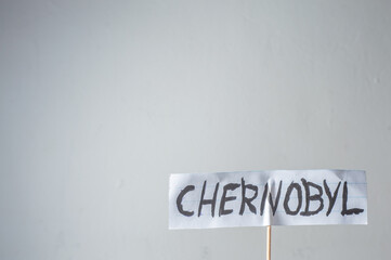 Chernobyl,word written on a cut paper,soured white background and copy space