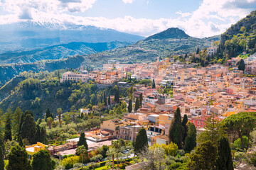 Fototapeta premium Taormina town panoramic view and Vesuvius mountain in Sicily island, Italy. Beautiful summer day. 