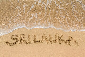 Sri Lanka written in a sandy