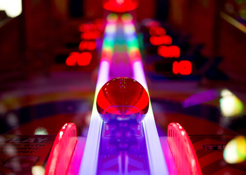 Low angle shot of a colorful arcade pinball game machine in Brighton