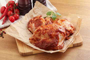 Marinated chicken leg in tomato sauce