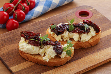 Bruschetta with soft cheese and tomato