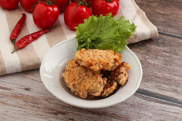 Fried salmonn cutlet in the bowl