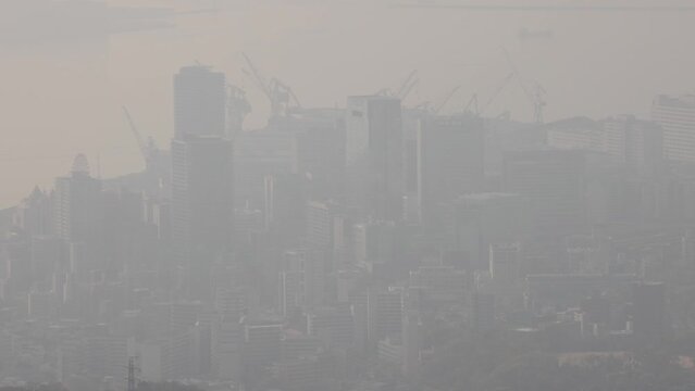 Heavy smog covers downtown city skyline