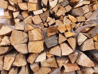 stacked firewood surface Available in supermarkets used as fuel The best firewood has to lose as much moisture as possible. to the air and sunlight