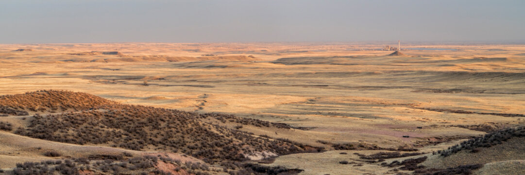 panoramic sunset view of northern Colorado foothills and plains with Rawhide Energy Station from Soapstone Prairie Natural Area