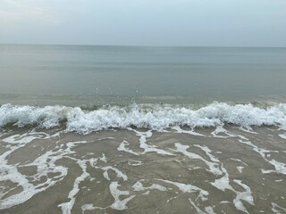 Sea foam, ripple of the sea.  Concept about relaxation in the holiday.  Sea and sky.  