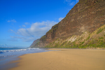 Western edge of the Na Pali cliffs on the beach of the Polihale State Park on Kauai island in Hawaii, United States