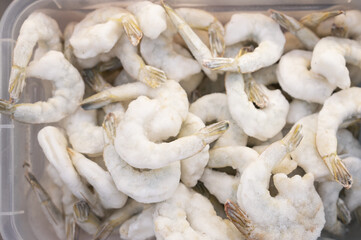 Frozen shrimp in fridge at the fish market. Healthy eating and fish market concept