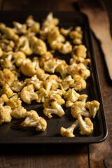 Roasted cauliflower on baking tray.
