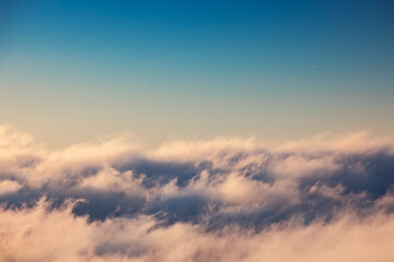 Flying above the clouds, sunrise sky view