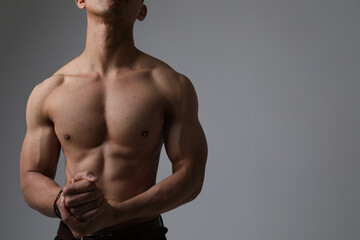 Fototapeta premium Cropped shot of male perfect body isolated on white background.