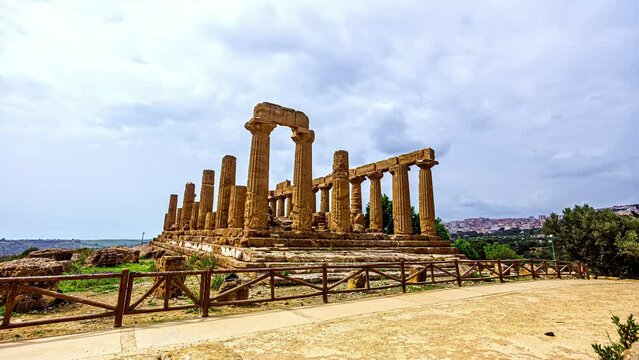 TIme lapse shot of person taking selfie picture in front of historic Valle dei Templi on Sicily Island