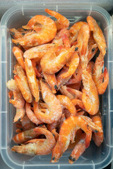 Frozen shrimp in fridge at the fish market. Healthy eating and fish market concept