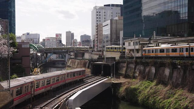 Multiple Tokyo train passing each other at Ochanomizu Station, Early Morning