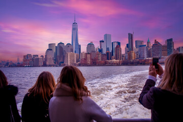 Statue Cruises ferry carrying tourists front of New York City ,