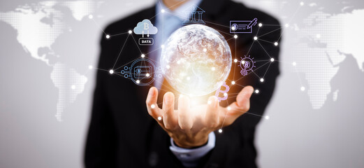 New metaverse with icon business concept,Business hand holding a virtual globe with financial icons future technology, bitcoin goals, online communication,graph Screen Icon of a media screen,big data