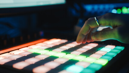 Music producer working on drum controller. Night session 