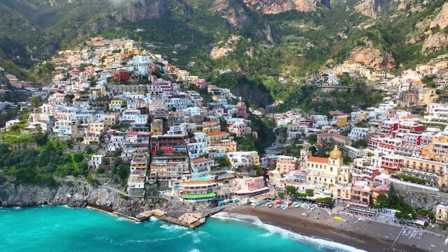 flying above idyllic colourful coastal town of Positano on the Amalfi coast Italy, holidays on Italian coast, famous Mediterranean resort with turquoise sea
