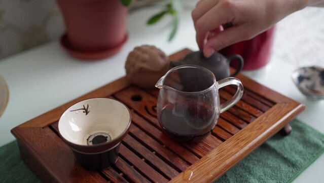 portable table for the tea ceremony. tea in a teapot, a bowl and a special funnel for tea