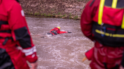 Rescue swimmers are practicing on dangerous weir 