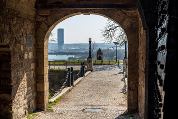 King's Gate of the Belgrade Fortress (Kalemegdan), Belgrade, Serbia. Overview on Belgrade waterfront tower building - obrazy, fototapety, plakaty