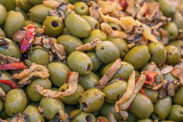 Pitted olives closeup, in italian food, Campagnola, green olives, food background, organic food, olives background.