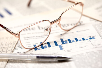 eyeglasses on the newspaper pages