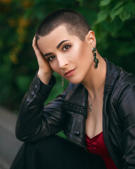 young beautiful girl with short hair in a leather jacket
